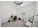 Bedroom with a ceiling fan, carpeted floor, and a bright window with neutral paint at 287 Lake Smart Cir, Winter Haven, FL 33881