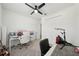 Bedroom with a ceiling fan, carpeted floor, closet with double doors, and neutral walls at 287 Lake Smart Cir, Winter Haven, FL 33881