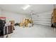 Two-car garage provides ample space for parking and storage with overhead door at 287 Lake Smart Cir, Winter Haven, FL 33881