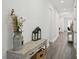 Hallway with wood-look floors and neutral walls leading to other rooms at 287 Lake Smart Cir, Winter Haven, FL 33881
