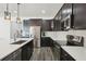 Modern kitchen with stainless steel appliances, stylish cabinets, and a bright countertop at 287 Lake Smart Cir, Winter Haven, FL 33881
