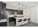 Kitchen with island, seating, and modern appliances at 287 Lake Smart Cir, Winter Haven, FL 33881
