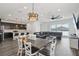 Open-concept living space with modern kitchen, dining area, and a comfortable seating area at 287 Lake Smart Cir, Winter Haven, FL 33881