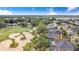 Aerial view of home near a golf course, featuring a lake in the distance at 2960 Kokomo Loop, Haines City, FL 33844