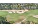 Aerial view of a house on a golf course; surrounded by mature trees at 2960 Kokomo Loop, Haines City, FL 33844