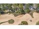 Home surrounded by a decorative sand trap on a golf course at 2960 Kokomo Loop, Haines City, FL 33844