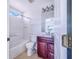 Bathroom featuring a vanity, toilet, and shower-tub combo at 2960 Kokomo Loop, Haines City, FL 33844