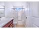 Bathroom featuring a vanity, toilet, and shower-tub combo at 2960 Kokomo Loop, Haines City, FL 33844