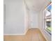 Bright foyer with tile flooring and a window letting in natural light at 2960 Kokomo Loop, Haines City, FL 33844