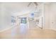 Spacious living room with neutral tones and sliding glass doors to the pool area at 2960 Kokomo Loop, Haines City, FL 33844
