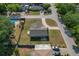 Aerial view of a gray home featuring spacious yard and convenient street access at 3022 Lantana Rd, Auburndale, FL 33823