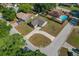 Aerial view of a well-maintained home with a curved driveway and mature trees at 3022 Lantana Rd, Auburndale, FL 33823
