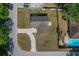 A detailed aerial view shows the home's roof, long driveway, and lawn at 3022 Lantana Rd, Auburndale, FL 33823