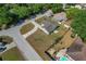 Aerial view showcases the home, curb appeal and neighborhood with tree-lined streets at 3022 Lantana Rd, Auburndale, FL 33823
