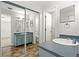 Bathroom features updated vanity, mirror, and tiled floors, with a doorway leading to the shower at 3022 Lantana Rd, Auburndale, FL 33823