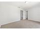 Neutral bedroom with carpeting, showcasing a closet and attached bathroom for convenience and privacy at 3022 Lantana Rd, Auburndale, FL 33823