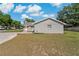 Charming home exterior, showcasing the side view, front yard, and driveway at 3022 Lantana Rd, Auburndale, FL 33823