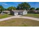 Inviting single-story home with well-maintained lawn and curved driveway entrance at 3022 Lantana Rd, Auburndale, FL 33823
