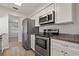Modern kitchen with stainless steel appliances, light-colored cabinets, and a sleek design at 3022 Lantana Rd, Auburndale, FL 33823
