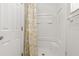 Shower boasts a floral curtain, bright white tub and walls, and adjacent door at 3022 Lantana Rd, Auburndale, FL 33823