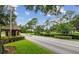 Gated community entrance with well-maintained landscaping and signage at 3158 Beauchamp Ct, Winter Haven, FL 33884