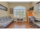 Office space with gray futon, desk, and bright window with plantation shutters at 3158 Beauchamp Ct, Winter Haven, FL 33884