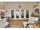 Patio featuring a table and chairs with view through french doors into living spaces at 3158 Beauchamp Ct, Winter Haven, FL 33884