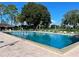 Community pool featuring lounge chairs, clear blue water, and a surrounding deck at 3158 Beauchamp Ct, Winter Haven, FL 33884