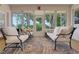 Bright sunroom filled with seating, a patterned rug, and views of nature, creating an inviting space at 3158 Beauchamp Ct, Winter Haven, FL 33884