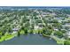 Overhead view of a community featuring homes with swimming pools in a lush, green neighborhood at 333 Lake Otis Se Dr, Winter Haven, FL 33880