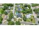 Aerial view of a residential neighborhood featuring homes with well-maintained lawns and mature trees at 333 Lake Otis Se Dr, Winter Haven, FL 33880