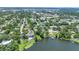 Wide aerial view featuring lakefront homes, neighborhood streets, and green spaces at 333 Lake Otis Se Dr, Winter Haven, FL 33880