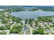 Scenic aerial view of homes nestled near a beautiful lake and lush greenery at 333 Lake Otis Se Dr, Winter Haven, FL 33880
