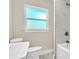 Modern bathroom showcasing tile surround, a new toilet, tub, and vanity, offering a fresh and clean look at 333 Lake Otis Se Dr, Winter Haven, FL 33880