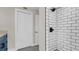 Bathroom showcasing a white subway-tiled shower with black hardware and gray tile floors at 333 Lake Otis Se Dr, Winter Haven, FL 33880