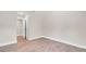 Bedroom showcasing laminate flooring, neutral paint, and a closet, creating a clean and inviting space at 333 Lake Otis Se Dr, Winter Haven, FL 33880