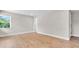 Bright bedroom featuring wood floors, natural light, and freshly painted walls at 333 Lake Otis Se Dr, Winter Haven, FL 33880