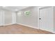 Bedroom featuring wood floors, natural light from two windows, and white base trim at 333 Lake Otis Se Dr, Winter Haven, FL 33880