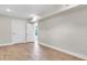 Bright bedroom featuring wood floors, freshly painted walls, and modern doors at 333 Lake Otis Se Dr, Winter Haven, FL 33880