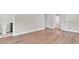Bedroom with light hardwood floors leading to a renovated bathroom with decorative tile at 333 Lake Otis Se Dr, Winter Haven, FL 33880