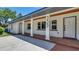 Close-up of the home's entrance featuring brick and white columns at 333 Lake Otis Se Dr, Winter Haven, FL 33880