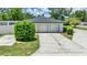 Detached two-car garage with ample parking space and lush landscaping at 333 Lake Otis Se Dr, Winter Haven, FL 33880