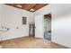 Garage featuring concrete floors, white walls, a water heater, and wood-look floors at 333 Lake Otis Se Dr, Winter Haven, FL 33880