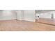 Spacious living room with laminate flooring, neutral paint colors, and an open floor plan at 333 Lake Otis Se Dr, Winter Haven, FL 33880