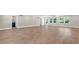 Bright living area features modern floors and neutral colors for a welcoming ambiance at 333 Lake Otis Se Dr, Winter Haven, FL 33880