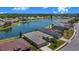 Beautiful property featuring lake views, lush green lawns and a screen enclosed patio, perfect for outdoor enjoyment at 3374 Waterlute Way, Lakeland, FL 33811