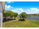 Relaxing backyard view with mature trees and beautiful water view adds privacy and tranquility at 3374 Waterlute Way, Lakeland, FL 33811