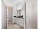 Bathroom with tile floor, granite counters, and tiled shower at 3374 Waterlute Way, Lakeland, FL 33811