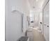 Bright bathroom featuring neutral tile, glass enclosed shower, and white cabinetry at 3374 Waterlute Way, Lakeland, FL 33811
