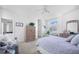 Bright bedroom with carpet, white walls, shuttered windows, and furnishings at 3374 Waterlute Way, Lakeland, FL 33811